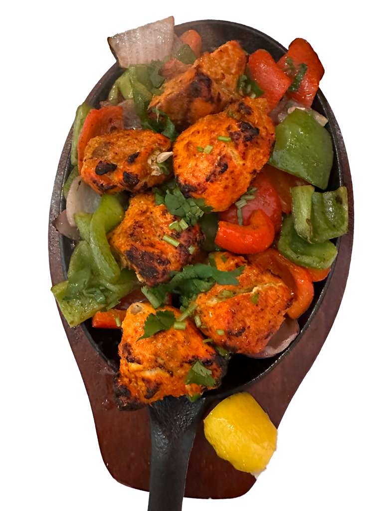 Chicken Tandoori on a sizzling plate with peppers and onions