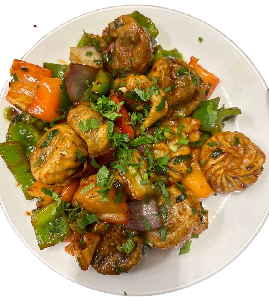 Chicken chilli momos with peppers and onions