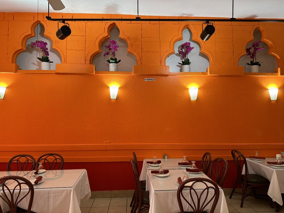 Restaurant interior with warm lighting and table seating